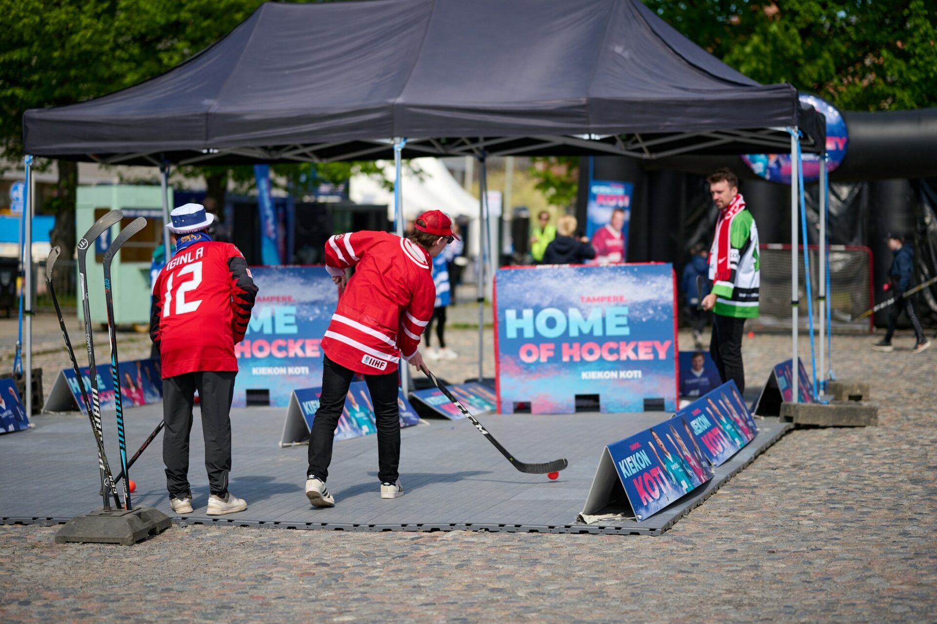 Hockey fans playing at the Home of Hockey zone.